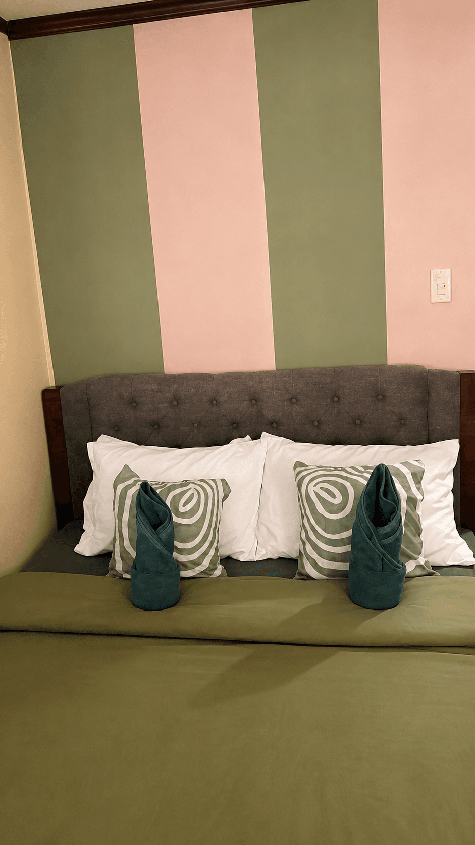 Bedroom with tufted headboard