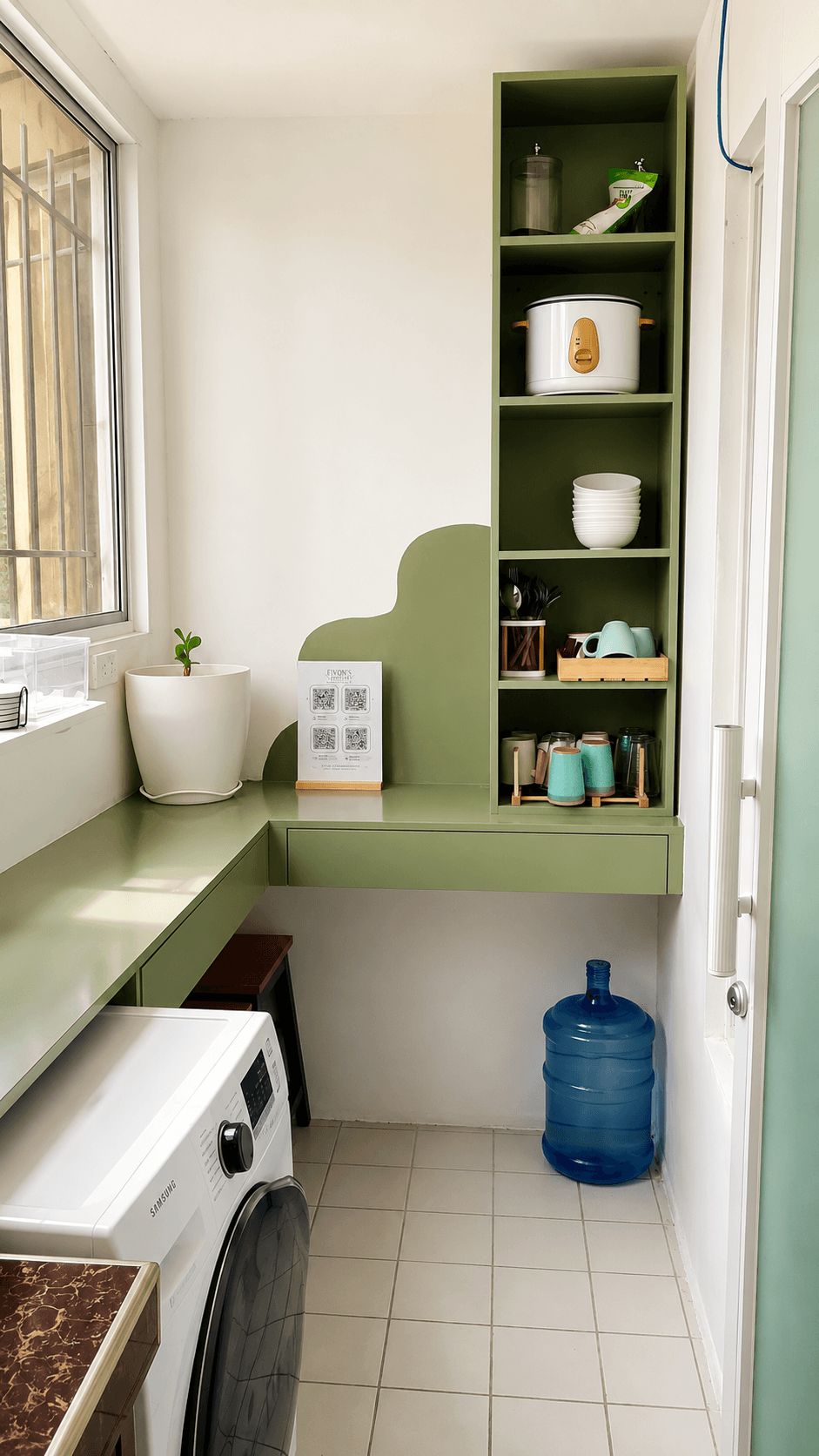 Green pantry nook with rice cooker, mugs, condiments and washer