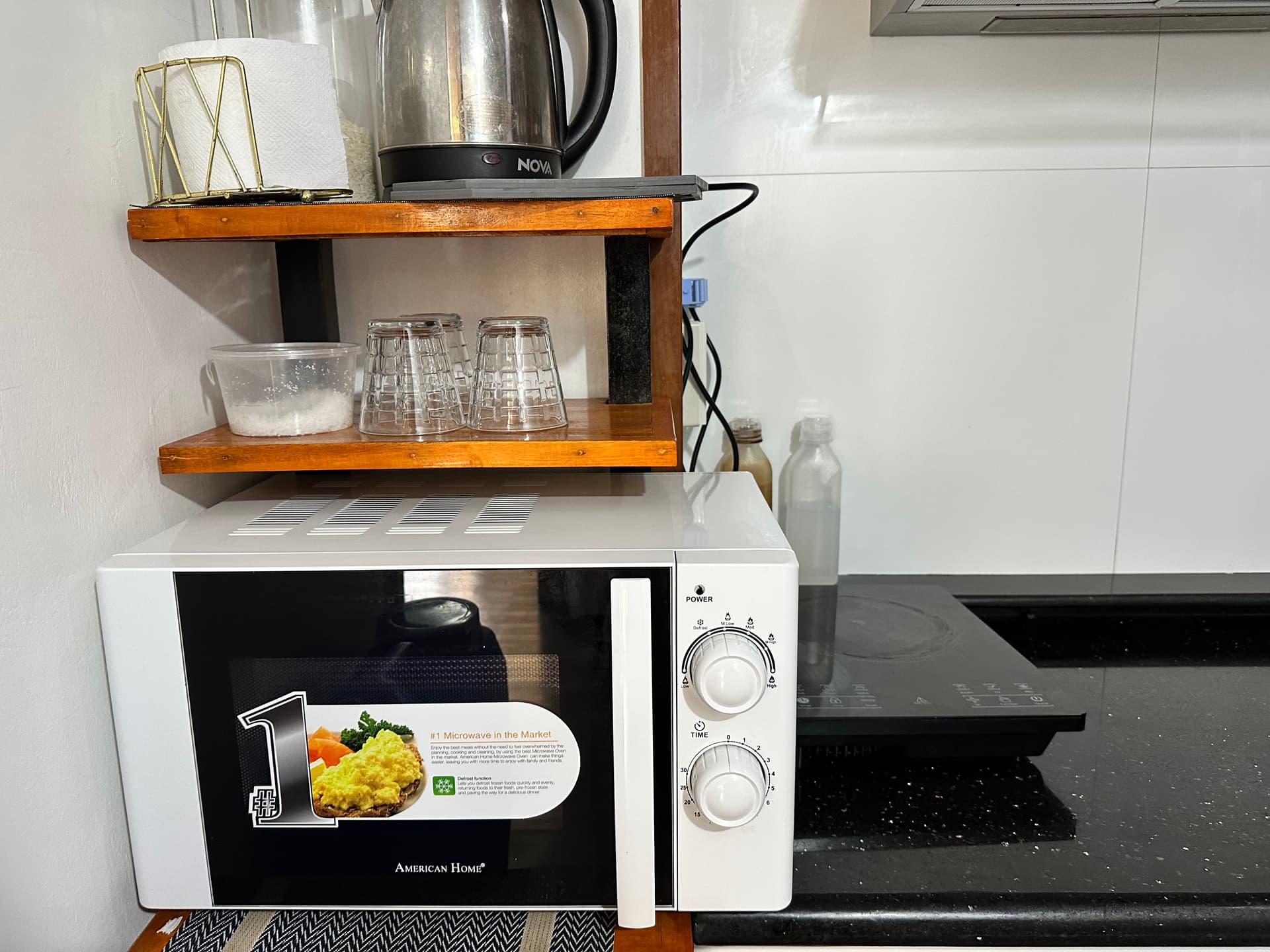 Kitchen with microwave, induction cooktop and electric kettle